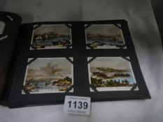 An album of views of the channel islands, Guernsey tobacco Co. & Papua new Guinea presentation sets,