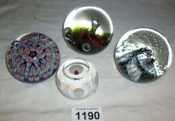 A Millifiori paperweight and 3 signed Caithness paperweights