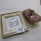 A small silver picture and an ink blotter