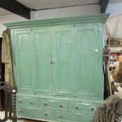 A large painted linen cupboard