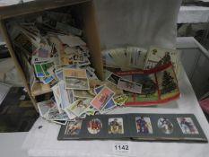 A mixed lot of cigarette and tea cards including rare Player's Navy Dress cards