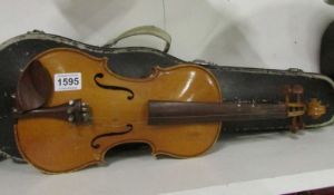 A cased violin and bow