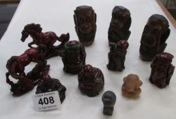 A quantity of carved and other figures