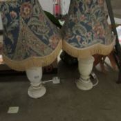 A pair of table lamps with shades