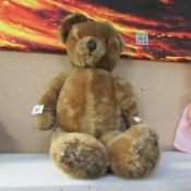 A vintage jointed teddy bear