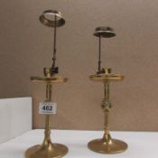 A pair of eccliastical brass candlesticks