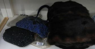 A mixed lot of fur muffs and beaded bags