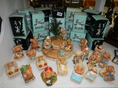 A Pendelfin stand and 21 Pendelfin rabbits