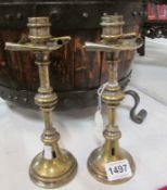 A pair of Arts and Crafts candlesticks