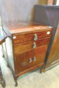 A mahogany music cabinet