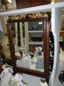 A freestanding dressing table mirror