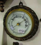 A circular aneroid barometer