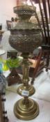 A brass oil lamp base with impressed font