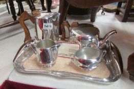 A 4 piece piquot ware tea set on tray (as new)