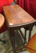 An oak barley twist gate leg table