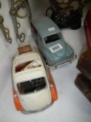 A model bubble car and station wagon