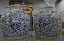 A pair of Chinese blue and white lidded jars