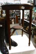 An oak circular table on tapered legs