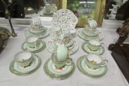 27 pieces of Minton 'Haddon Hall' teaware and 10 pieces of Imperial bone china teaware
