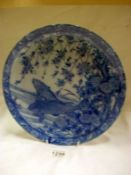 A large Japanese hand painted blue and white fish plate