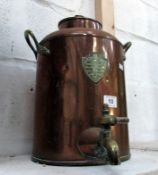 A vintage copper and brass urn