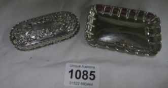 A silver card tray and pill box