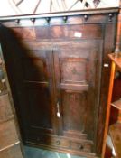 An oak corner cupboard