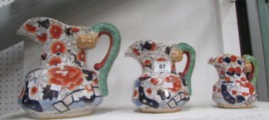 A set of 3 Ironstone graduated jugs