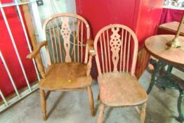 A wheel back carver chair and one other