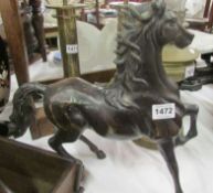 A large bronze figure of a horse