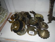 A mixed lot of horse brasses some on leathers