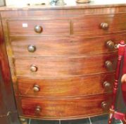 A 2 over 4 mahogany bow front chest of drawers