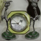 A pair of Deco figure candlesticks and a clock