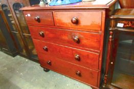 A 2 over 3 stained pine chest of drawers