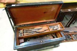 A pine tool box with four mahogany trays with tools