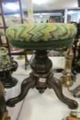 A Victorian mahogany revolving piano stool