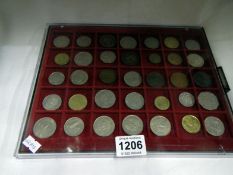 A tray of mixed foreign coins