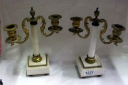 A pair of gilt and marble candelabra