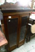 A 2 door glazed mahogany cabinet