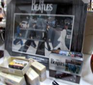 A Beatle's print and a Beatle's gift set with car and T shirt