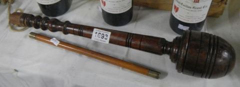 A large old cosh and a wooden ruler