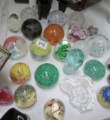 A quantity of glass paperweights