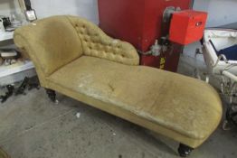 A chaise longue in need of reupholstery
