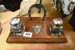 An oak inkstand with horseshoe pen rack