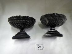 A pair of Victorian purple swirl slag glass footed dishes