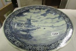 A large Delft blue and white charger