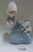 A Lladro girl with cat and dog