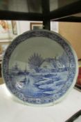 A large Delft blue and white charger