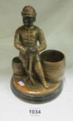An early 20th century terracotta figure of a soldier