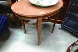 An oval table on tapered legs